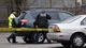 Safety officials inspect vehicles in Watertown, Mass., during the search for Dzhokhar Tsarnaev.
