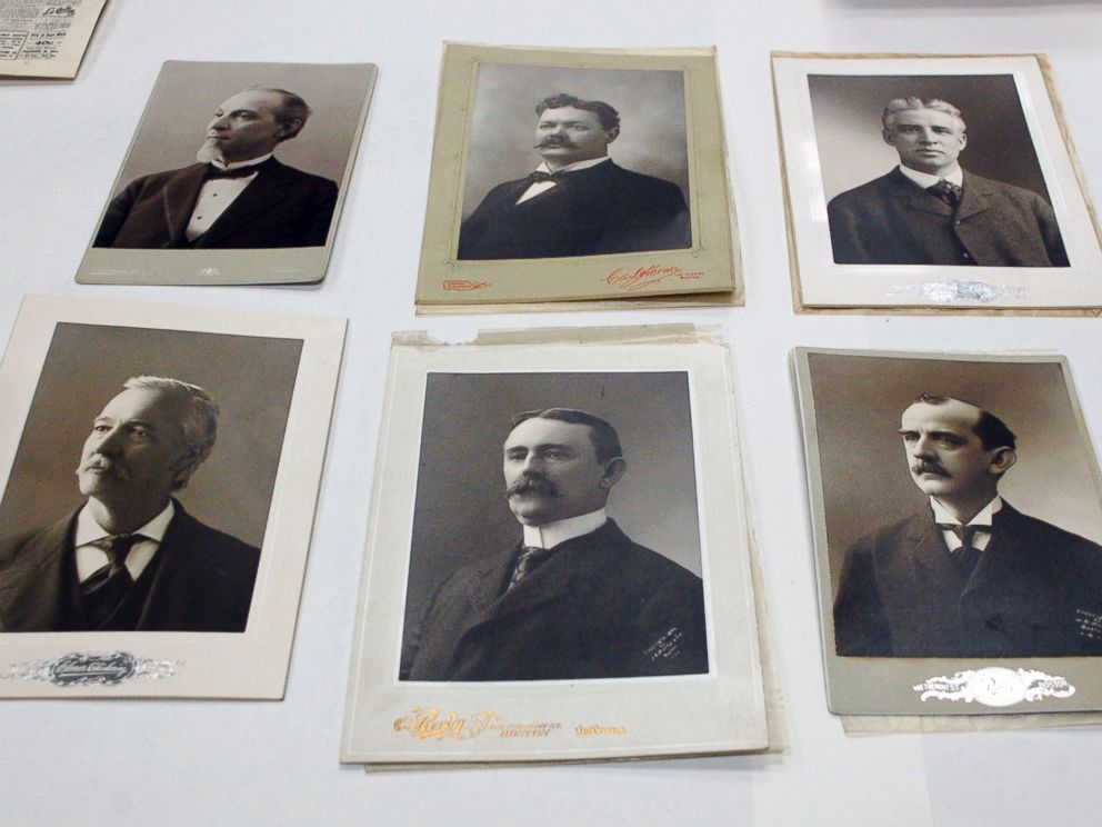 PHOTO: Photographs of city and state elected officials, including Boston Mayor Thomas Norton Hart at top left, are displayed after they were taken from a 1901 time capsule in Boston.